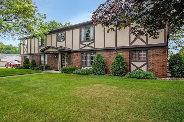 22811 Grove St, Saint Clair Shores, MI 48080 - tudor home with brick siding and a front yard
