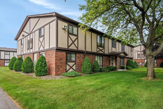 22811 Grove St, Saint Clair Shores, MI 48080 - view of front of home with brick siding and a front yard