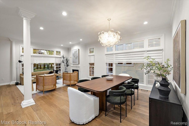 855 Wallace St, Birmingham, MI 48009 - dining room with ornate columns, ornamental molding, a fireplace, light wood-style flooring, and recessed lighting