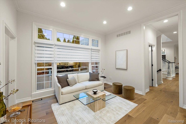 855 Wallace St, Birmingham, MI 48009 - living room featuring recessed lighting, ornamental molding, light wood-style floors, healthy amount of natural light, and stairway