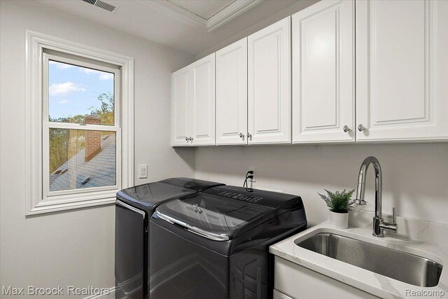 855 Wallace St, Birmingham, MI 48009 - laundry room with cabinet space, washing machine and clothes dryer, and crown molding