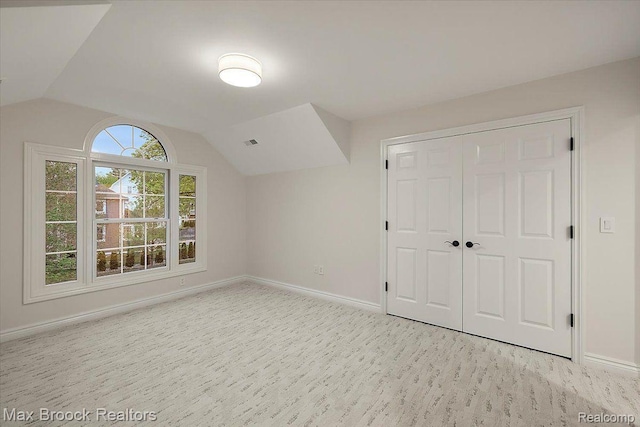 855 Wallace St, Birmingham, MI 48009 - additional living space featuring baseboards and lofted ceiling