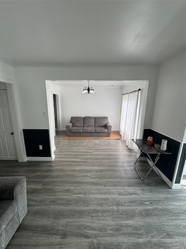 20789 Marie Ave, Warren, MI 48089 - living room featuring dark wood-type flooring and a chandelier