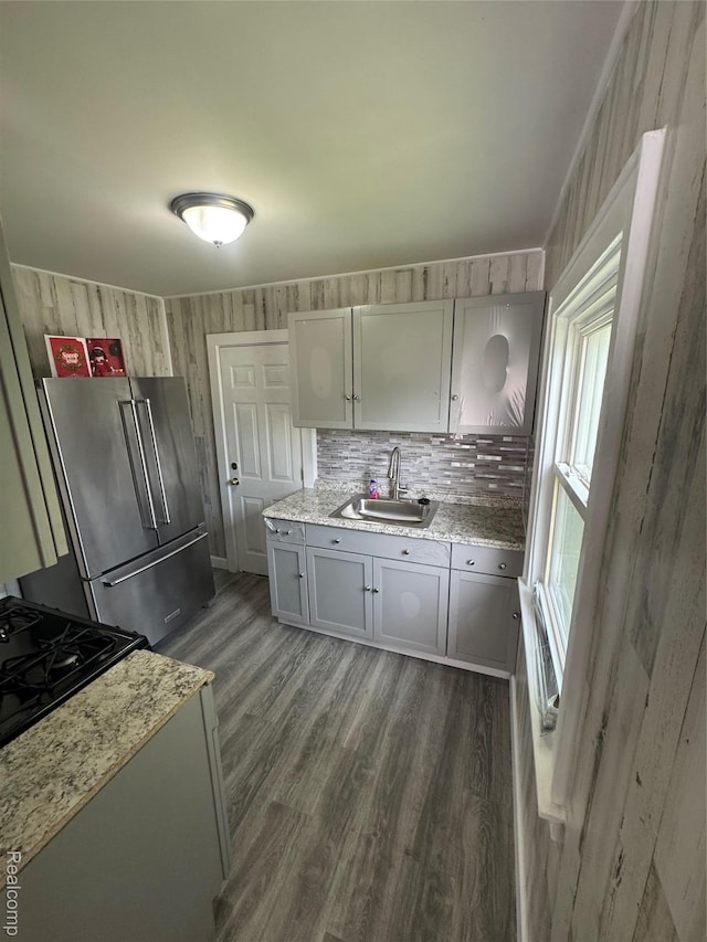 20789 Marie Ave, Warren, MI 48089 - kitchen featuring high quality fridge, dark wood-style floors, light stone countertops, tasteful backsplash, and gray cabinetry