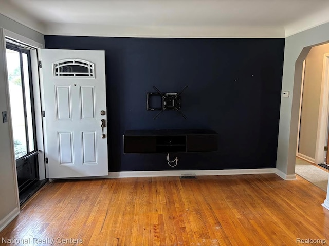 1618 E Lincoln Ave, Royal Oak, MI 48067 - entryway with healthy amount of natural light, wood finished floors, and arched walkways