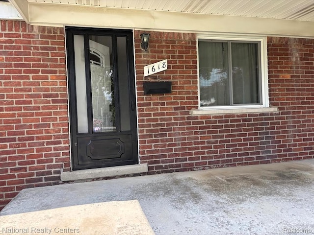 1618 E Lincoln Ave, Royal Oak, MI 48067 - doorway to property with brick siding
