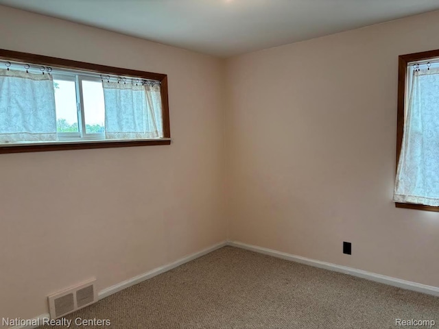 1618 E Lincoln Ave, Royal Oak, MI 48067 - carpeted empty room featuring baseboards