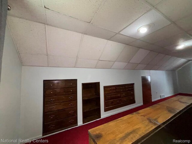1618 E Lincoln Ave, Royal Oak, MI 48067 - unfurnished bedroom featuring a drop ceiling and vaulted ceiling