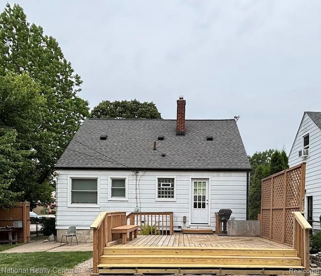 1618 E Lincoln Ave, Royal Oak, MI 48067 - back of property with a deck, a chimney, and roof with shingles