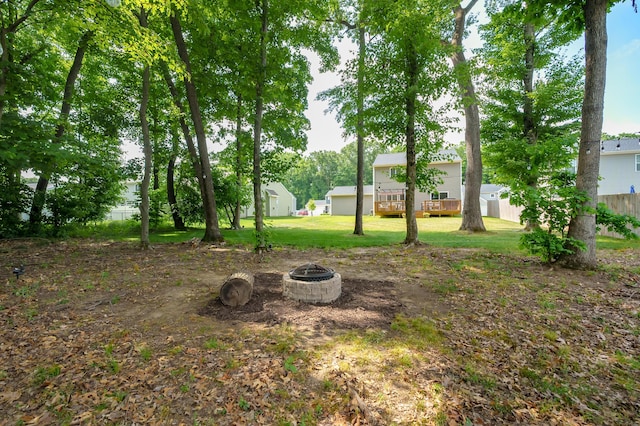 25596 Forest Ln, Mattawan, MI 49071 - view of green lawn featuring an outdoor fire pit and a deck