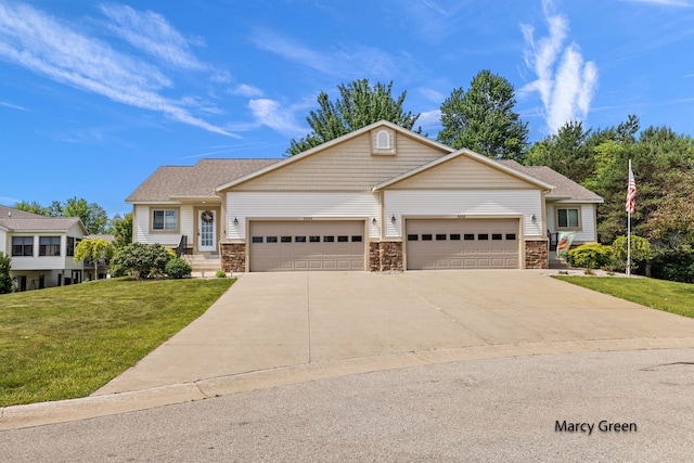 5589 Sandalwood Ct Unit 22, Norton Shores, MI 49441 - view of front facade featuring an attached garage, concrete driveway, a front lawn, and stone siding