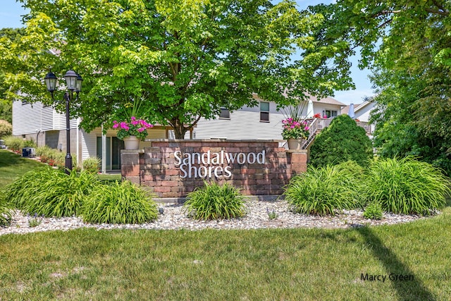5589 Sandalwood Ct Unit 22, Norton Shores, MI 49441 - community / neighborhood sign with a lawn