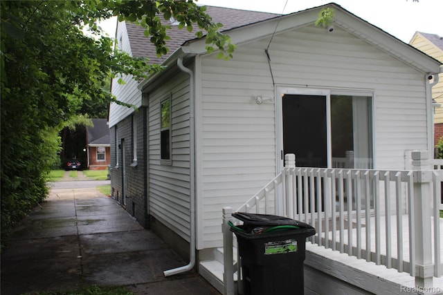 20153 Hartwell St, Detroit, MI 48235 - view of property exterior with roof with shingles and a deck