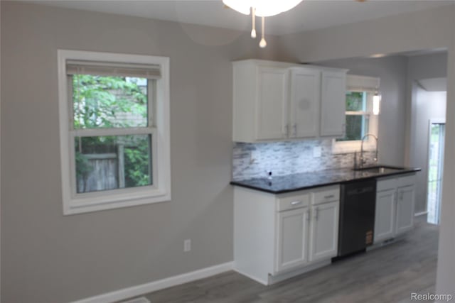 20153 Hartwell St, Detroit, MI 48235 - kitchen featuring black dishwasher, tasteful backsplash, wood finished floors, and healthy amount of natural light