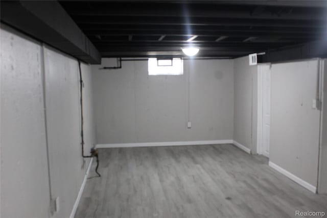 20153 Hartwell St, Detroit, MI 48235 - below grade area with wood finished floors and baseboards