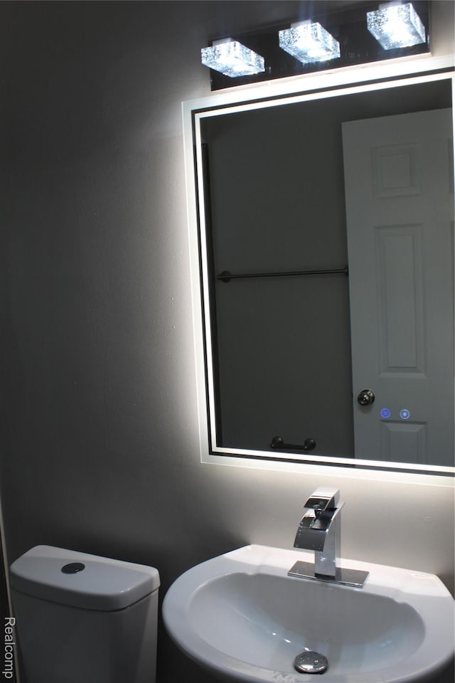 20153 Hartwell St, Detroit, MI 48235 - half bathroom with a sink and toilet