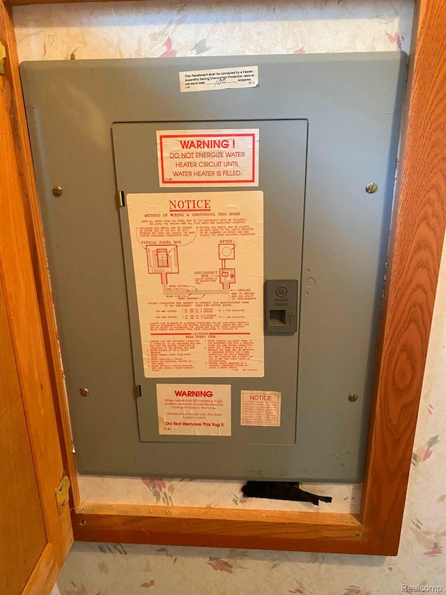 5424 Hughes Rd, Lansing, MI 48911 - utility room featuring electric panel