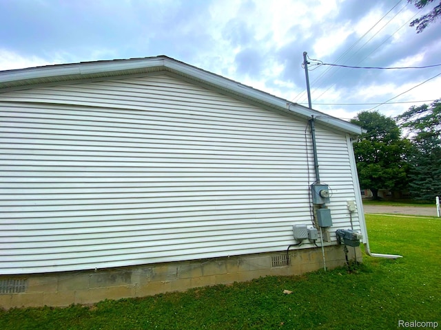 5424 Hughes Rd, Lansing, MI 48911 - view of home's exterior with crawl space and a lawn