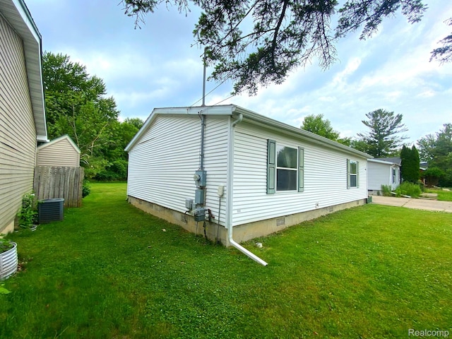 5424 Hughes Rd, Lansing, MI 48911 - view of side of property featuring crawl space and a central AC unit