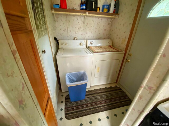 5424 Hughes Rd, Lansing, MI 48911 - laundry area with washer and dryer and tile patterned floors