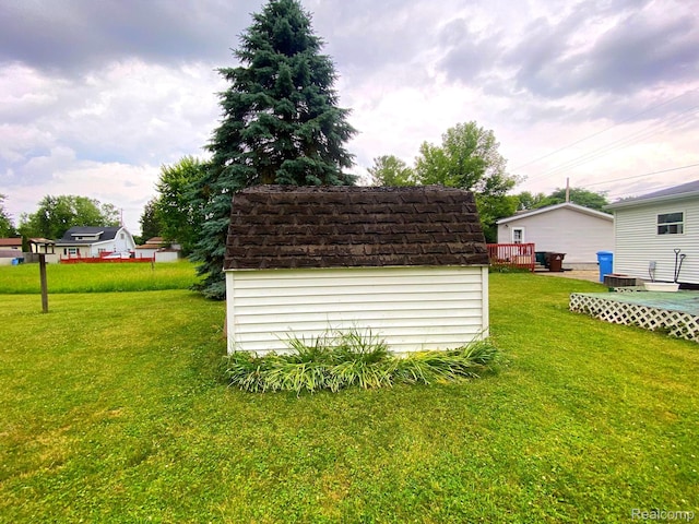 5424 Hughes Rd, Lansing, MI 48911 - view of green lawn featuring a storage shed