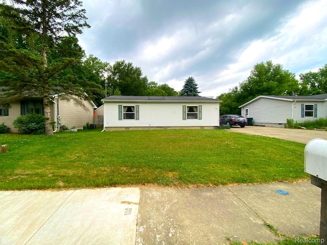 5424 Hughes Rd, Lansing, MI 48911 - view of front of property featuring a front yard