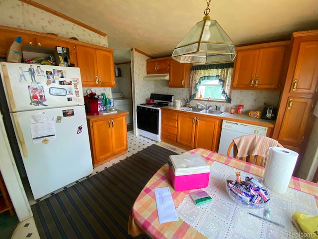 5424 Hughes Rd, Lansing, MI 48911 - kitchen featuring white appliances, ventilation hood, light countertops, wallpapered walls, and washer / clothes dryer