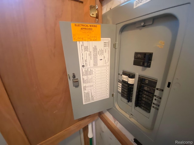 5424 Hughes Rd, Lansing, MI 48911 - utility room featuring electric panel