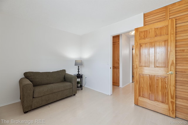 9451 Parkwood N, Davison, MI 48423 - sitting room featuring baseboards and wood finished floors