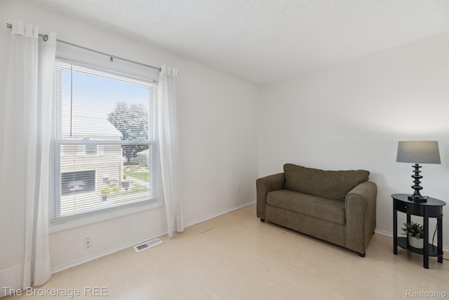 9451 Parkwood N, Davison, MI 48423 - sitting room with baseboards and a textured ceiling