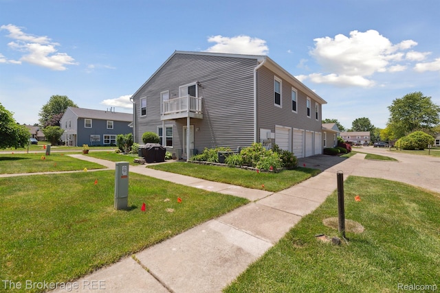 9451 Parkwood N, Davison, MI 48423 - view of front of house with a garage, asphalt driveway, a front yard, and a balcony