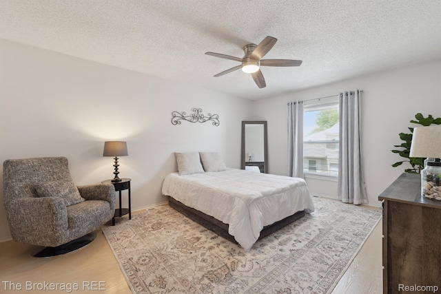 9451 Parkwood N, Davison, MI 48423 - bedroom with a textured ceiling, light wood finished floors, and ceiling fan