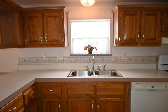4105 Sawgrass Trl, Muskegon, MI 49442 - kitchen with white dishwasher, light countertops, brown cabinetry, and ornamental molding