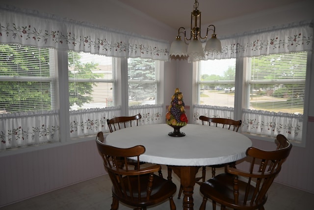 4105 Sawgrass Trl, Muskegon, MI 49442 - dining space featuring a chandelier, tile patterned floors, crown molding, and vaulted ceiling