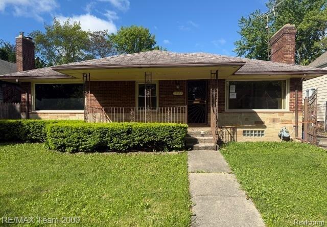 3929 Grayton St, Detroit, MI 48224 - ranch-style home with brick siding, a front lawn, a chimney, and a porch