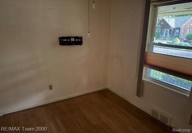3929 Grayton St, Detroit, MI 48224 - unfurnished room featuring wood finished floors and baseboards
