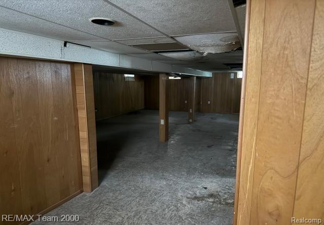 3929 Grayton St, Detroit, MI 48224 - finished below grade area featuring wooden walls and carpet floors