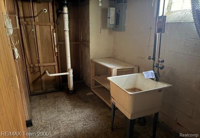 3929 Grayton St, Detroit, MI 48224 - below grade area with electric panel, concrete block wall, and tile patterned floors