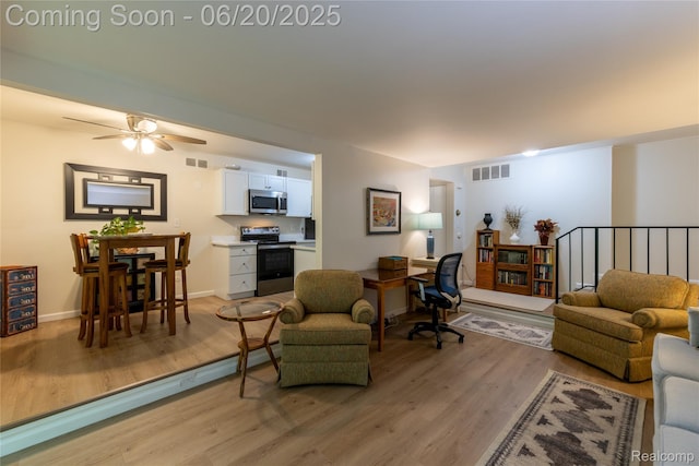 16591MIDDLEBELTRD Middlebelt Rd Unit 4, Livonia, MI 48154 - living room featuring light wood-type flooring, a desk, and ceiling fan