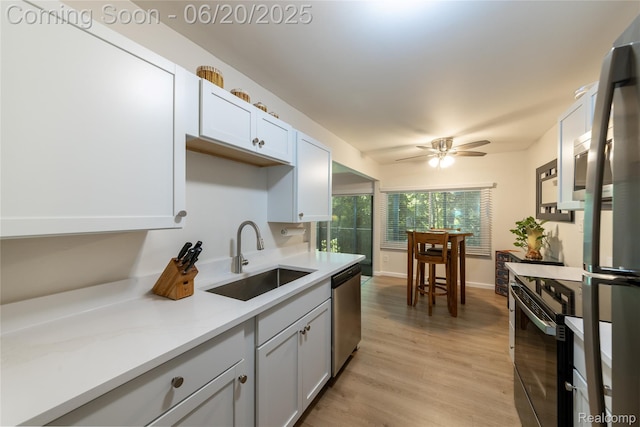 16591MIDDLEBELTRD Middlebelt Rd Unit 4, Livonia, MI 48154 - kitchen featuring stainless steel appliances, light countertops, a ceiling fan, and light wood-style flooring