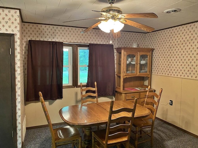 9810 E School Section Lake Dr, Mecosta, MI 49332 - dining space featuring wallpapered walls, ceiling fan, and carpet flooring