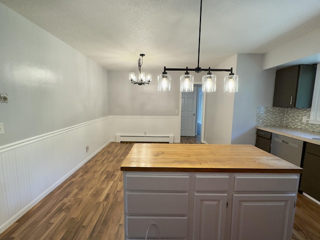 1358 Neece Dr, Norton Shores, MI 49441 - kitchen featuring butcher block countertops, baseboard heating, dark wood finished floors, a center island, and wainscoting