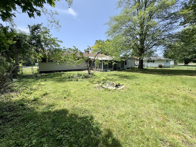 1358 Neece Dr, Norton Shores, MI 49441 - view of yard with a sunroom
