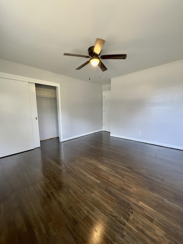 1358 Neece Dr, Norton Shores, MI 49441 - unfurnished bedroom featuring dark wood-type flooring, a closet, and ceiling fan