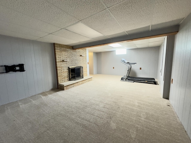 1358 Neece Dr, Norton Shores, MI 49441 - finished below grade area featuring carpet, a brick fireplace, wood walls, and a paneled ceiling