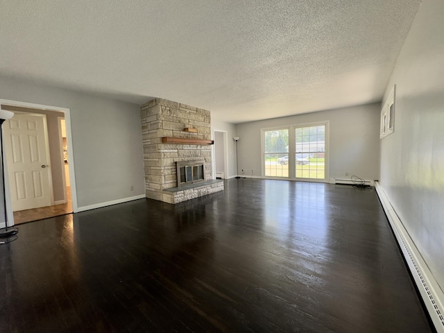 1358 Neece Dr, Norton Shores, MI 49441 - unfurnished living room with baseboard heating, wood finished floors, a textured ceiling, and a fireplace