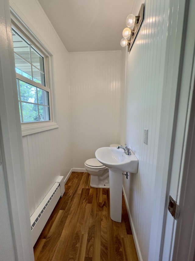 1358 Neece Dr, Norton Shores, MI 49441 - half bath featuring baseboard heating and wood finished floors