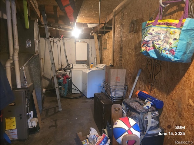3145 Raywood St, Flint, MI 48504 - unfinished below grade area with washer and clothes dryer and heating unit