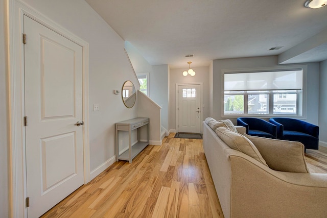 982 Lake Ridge Dr, Traverse City, MI 49684 - entryway featuring light wood-style flooring and baseboards