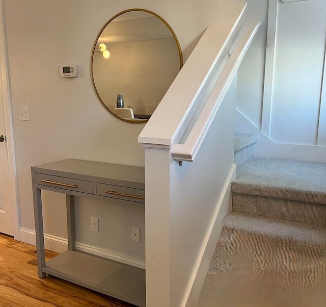 982 Lake Ridge Dr, Traverse City, MI 49684 - staircase featuring wood finished floors